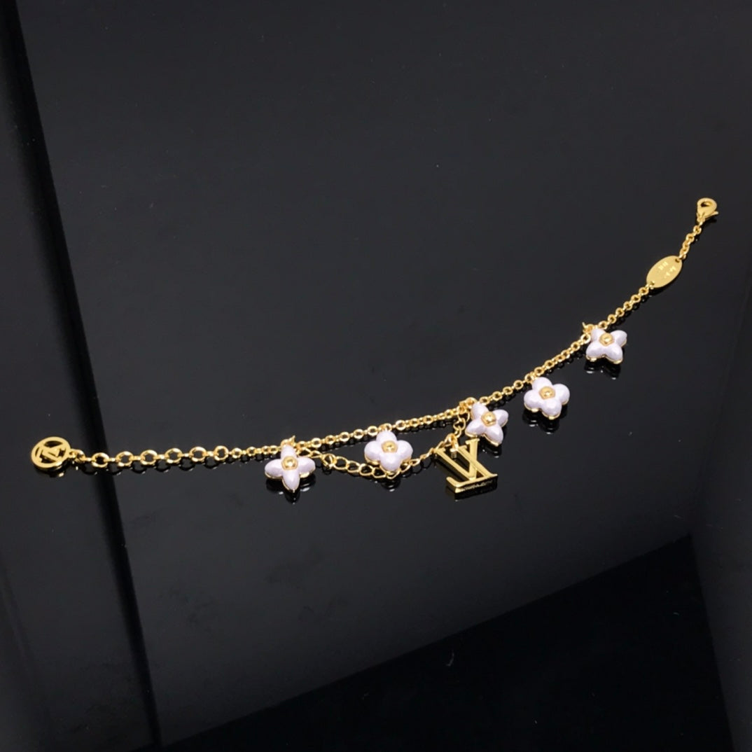 TimiLOGO 6 MOTIF STAR AND SUN GOLD BRACELET